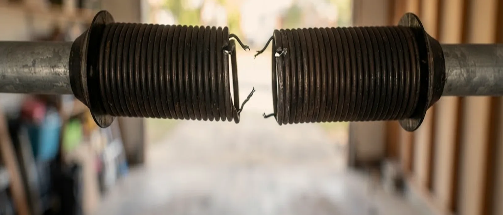 Broken torsion spring above a garage door in Meridian